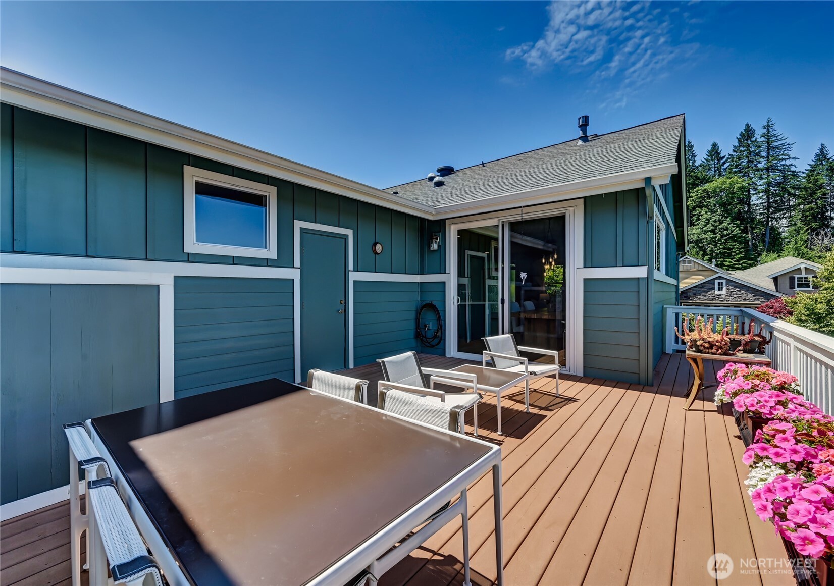 Plenty of room for container gardening and your flowers and vegetables will be so happy! The door to the left leads to the garage so you don't have to drag gardening "stuff" through the house.