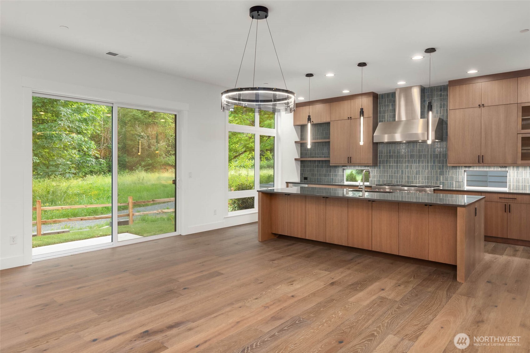8 Foot Sliding Door opens to patio and greenbelt backing rear yard