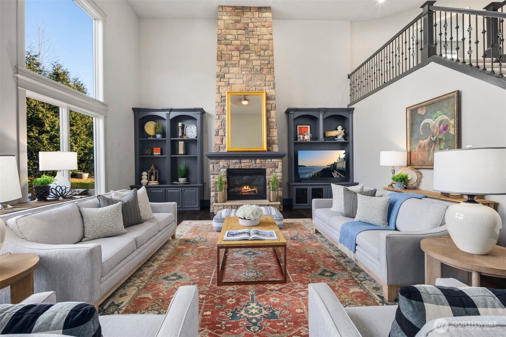 WOW! The Impressive Family Room With 2-Story Ceiling Is Designed For Both Grandeur And Comfort. Built-In Custom Shelving Surrounds The Stone Fireplace.