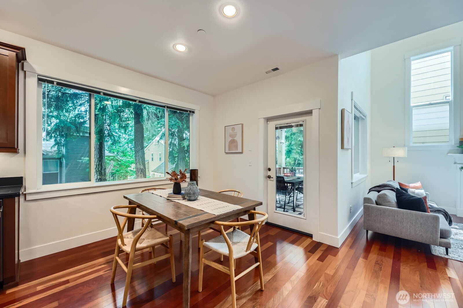 Dining space will easily accommodate a dining set for 6. Adjacent covered deck allows for year round outdoor dining. Sun shade on deck for privacy.