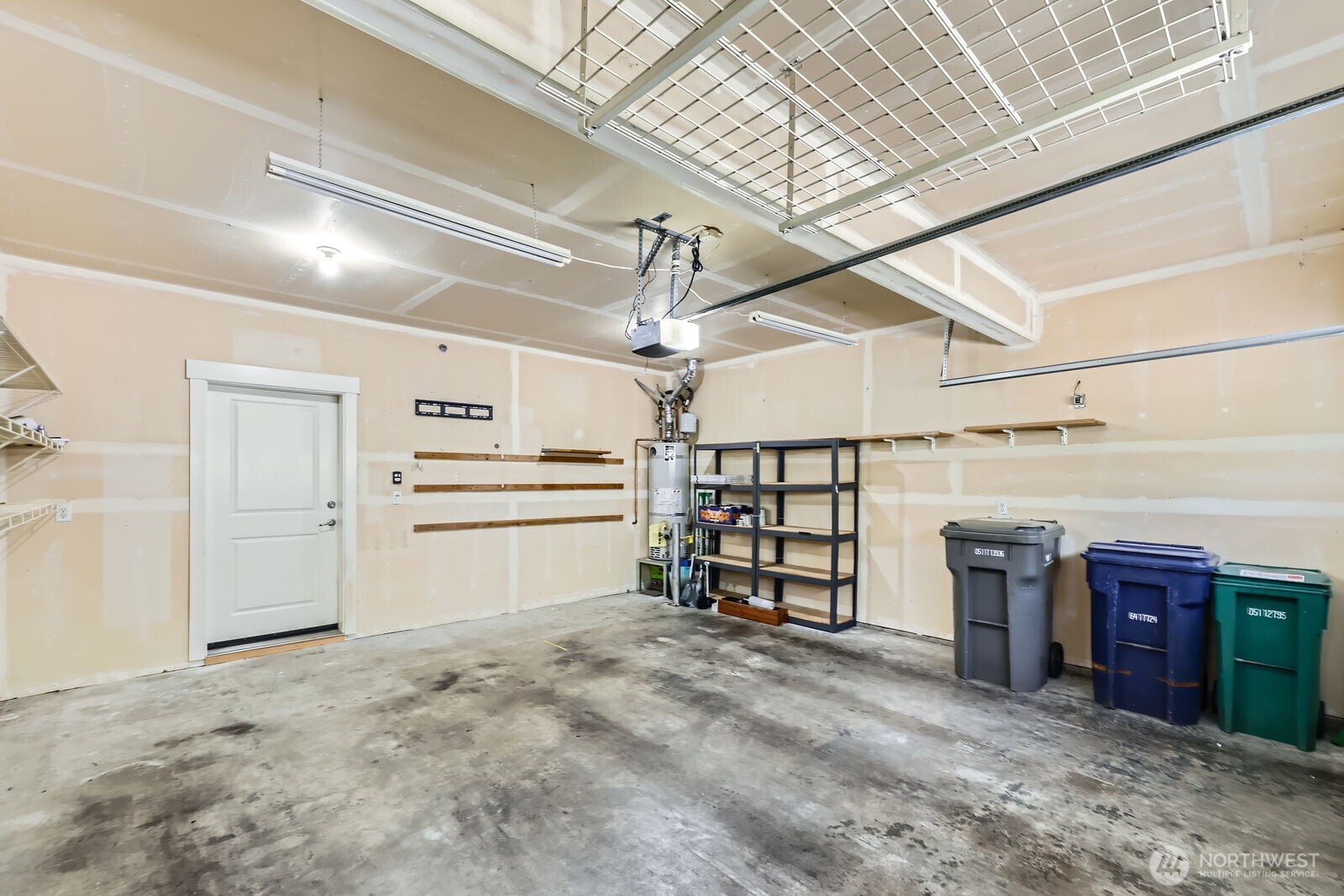 2 Car garage with storage in the rafters.