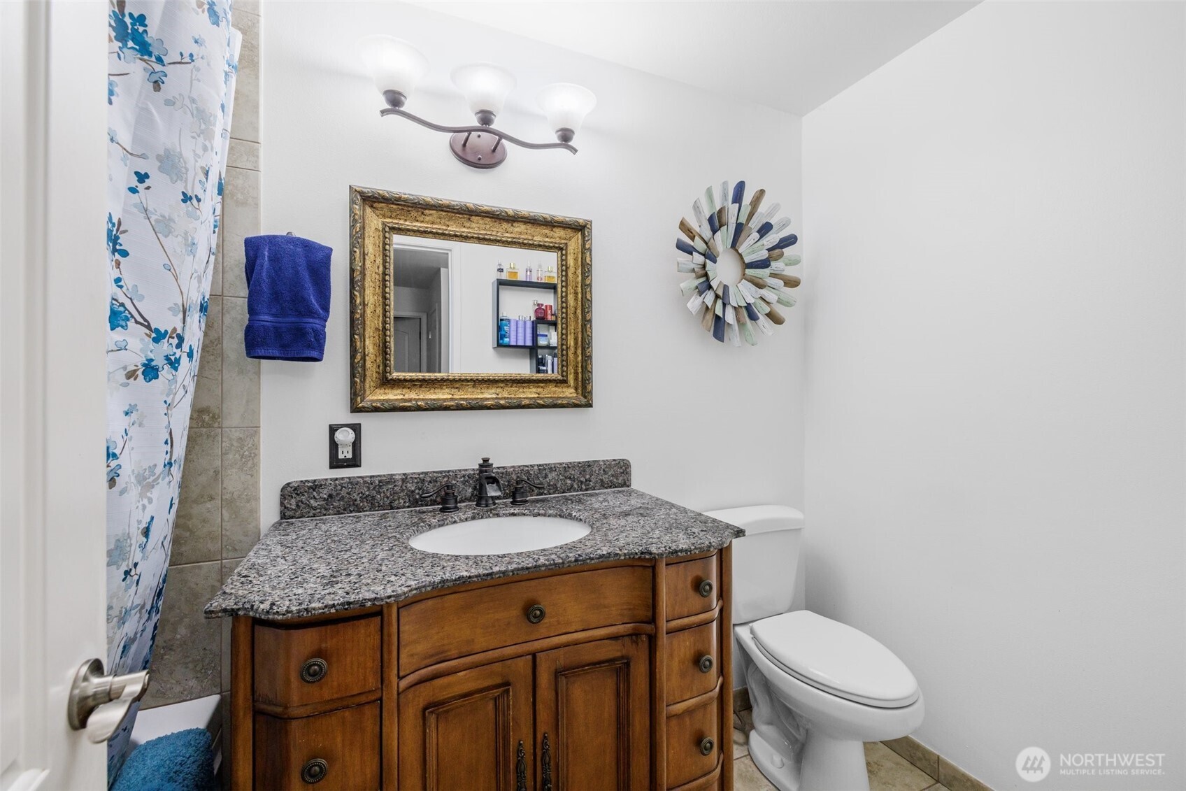 Featuring a well-lit vanity and a spacious layout, this full bath is designed for comfort and everyday ease.