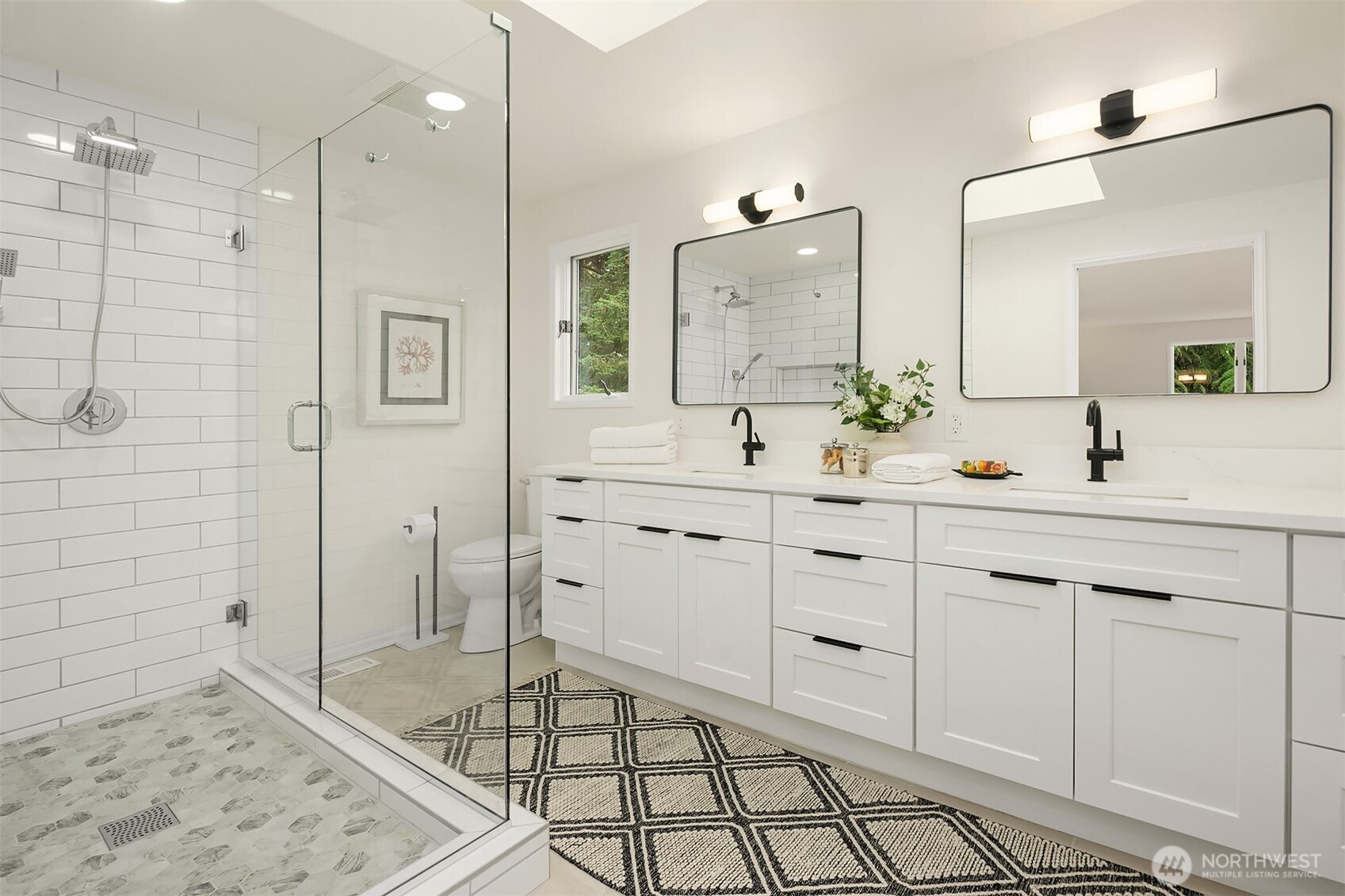 Primary skylit bath with heated floors.