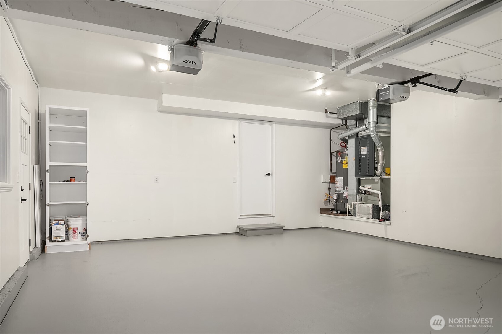 Large 2-car garage with storage & freezer.