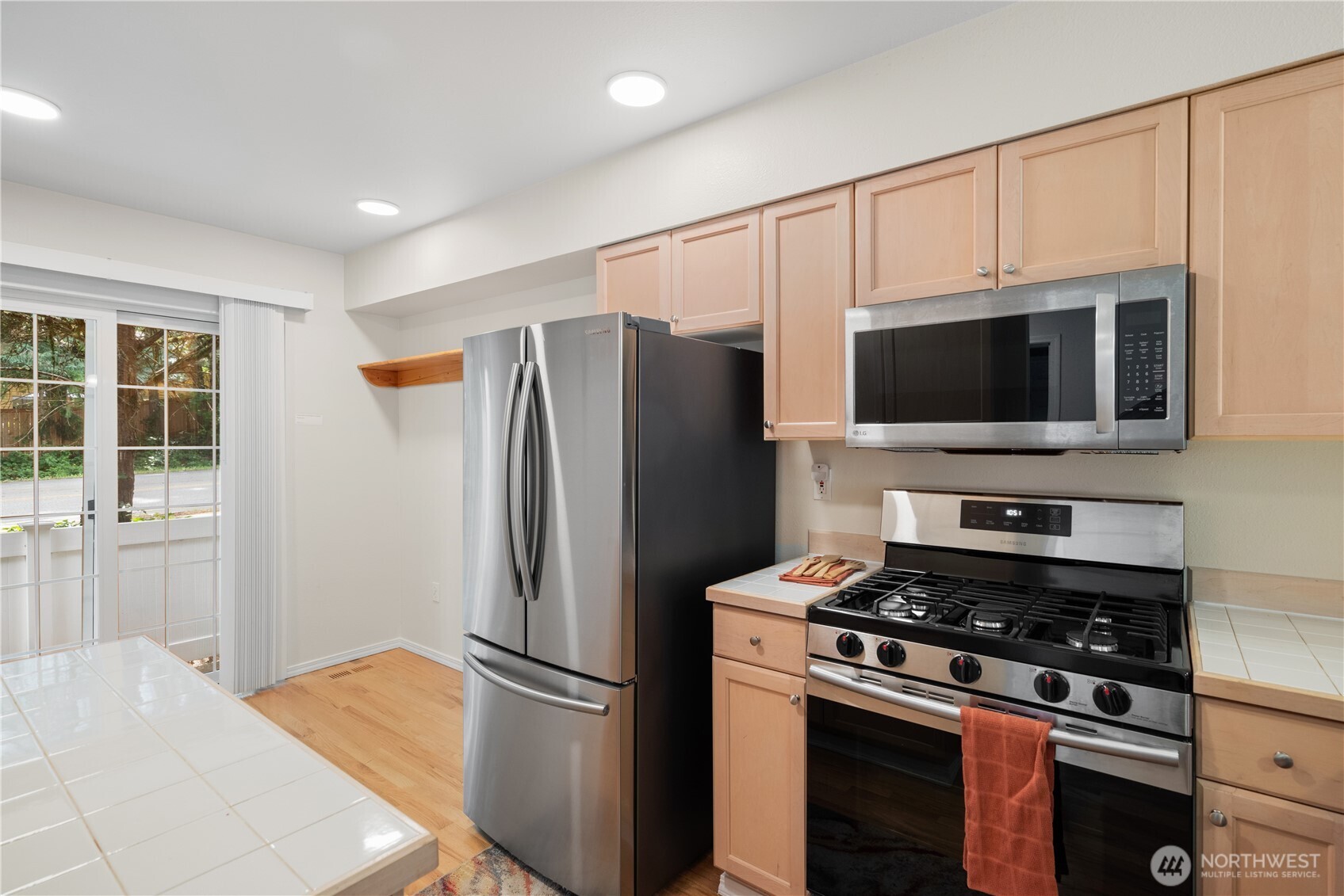 Kitchen facing eating area and patio