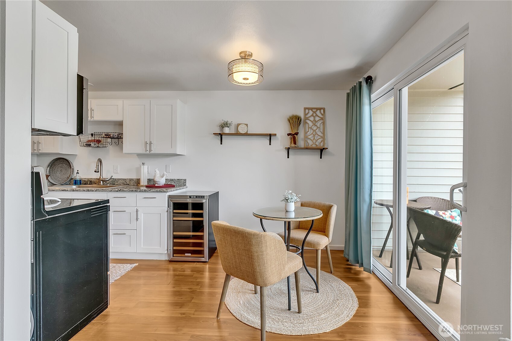 Kitchen dining with slider accesses the private view deck