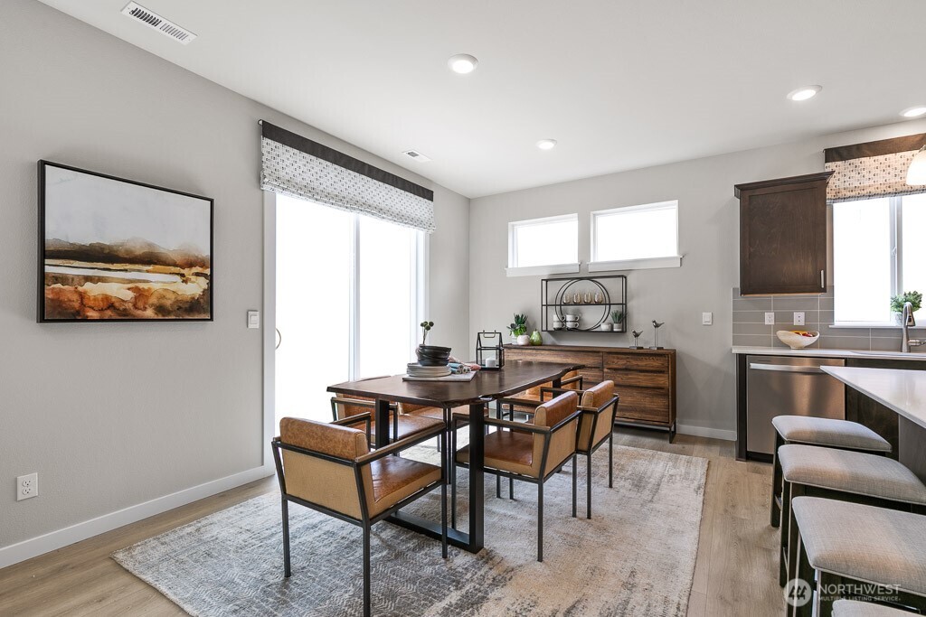 Huge center island to accommodate 4 bar stools next to dining area. Photos are representational. Actual colors and finishes will vary. See site agent for details.