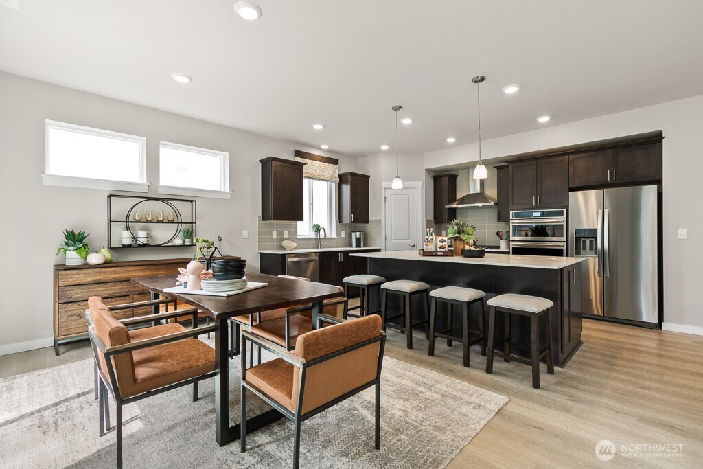 Huge center island to accommodate 4 bar stools. Photos are representational. Actual colors and finishes will vary. See site agent for details.