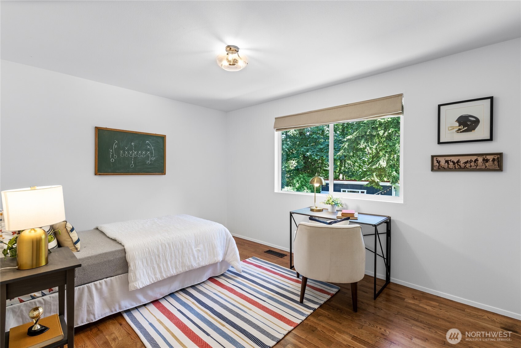 One of three spacious secondary bedrooms upstairs.