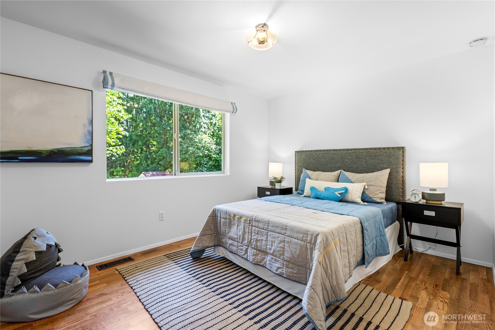 One of three spacious secondary bedrooms upstairs.