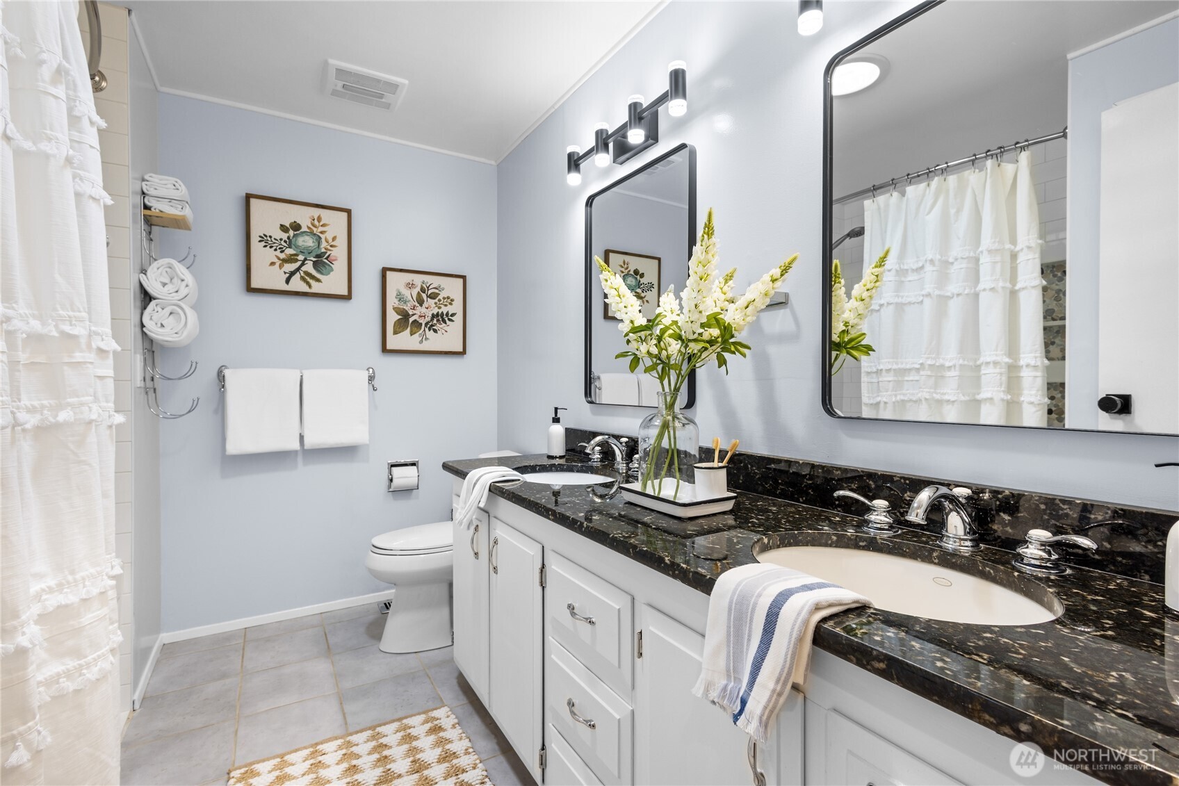 The upstairs full bath conveniently serves the secondary bedrooms, offering comfort and functionality for family or guests.