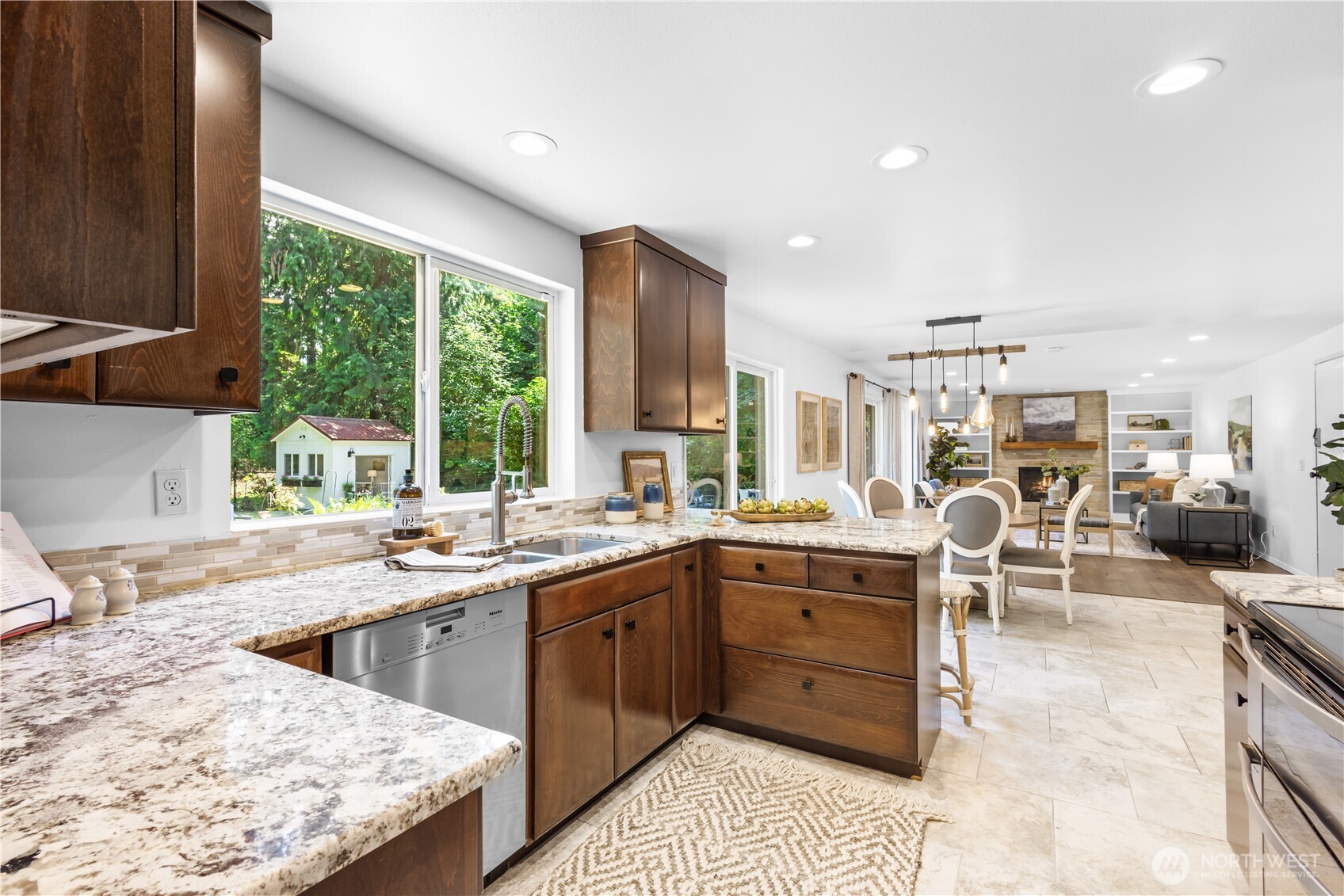 The open floor plan keeps you connected to the action while cooking—whether chatting with family and guests relaxing in the family room or enjoying serene views of the backyard through the storybook windows.