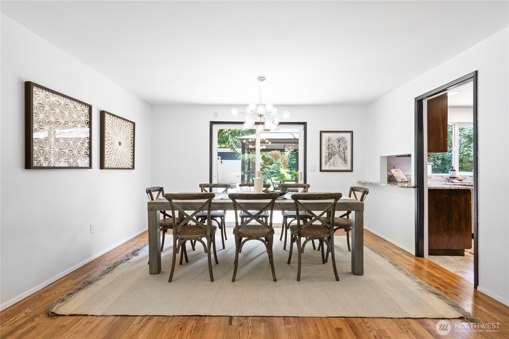 Conveniently located off the kitchen, the formal dining room features sliding doors that open to the backyard—an ideal layout for effortless indoor-outdoor entertaining.