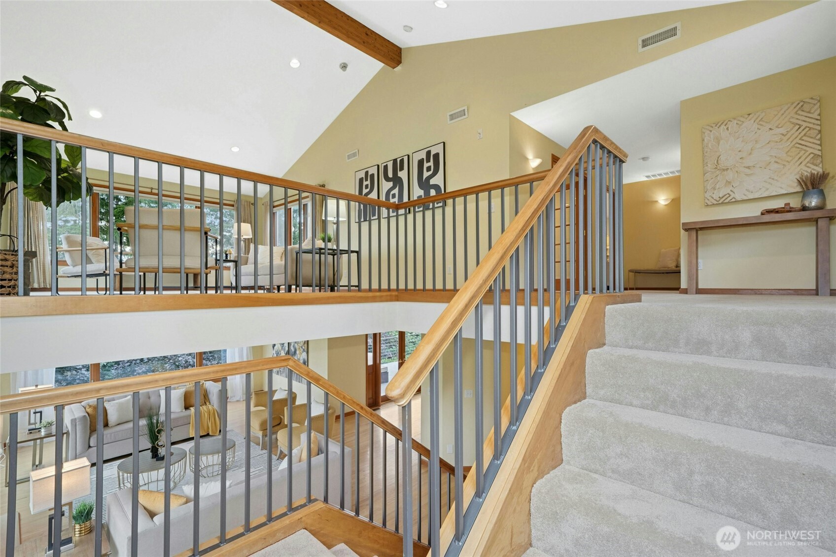 This pic sums the most important part of home Living and Loft room with lots of windows and vaulted ceilings