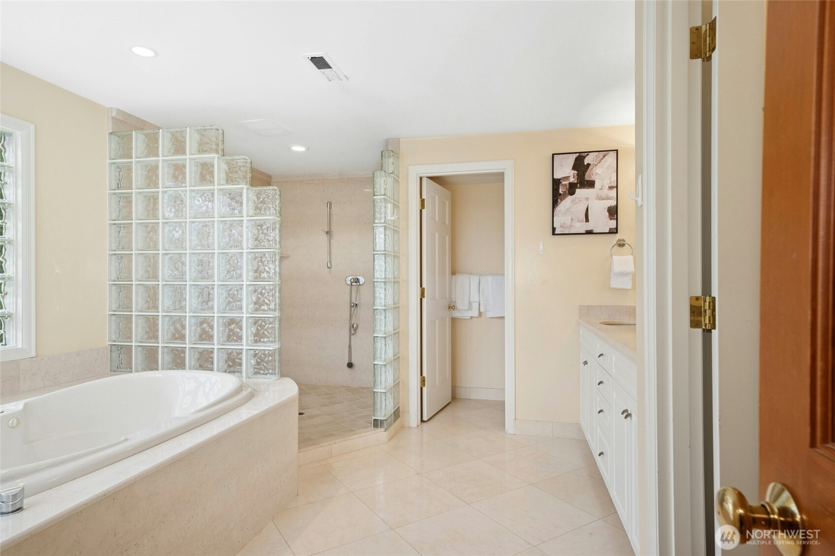 Bright, modern bath with sleek finishes