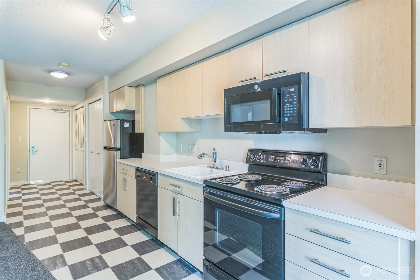 Beautiful Italian tile flooring extends through the kitchen, entry, and bath—adding timeless style and durability.