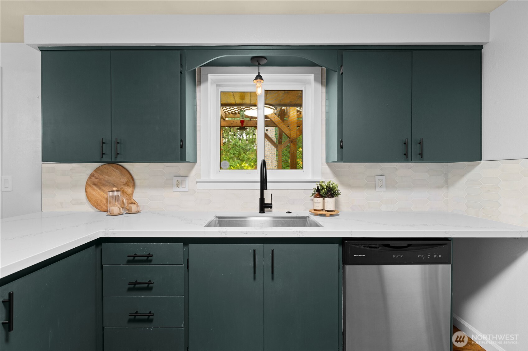 Look out your kitchen window to your backyard oasis