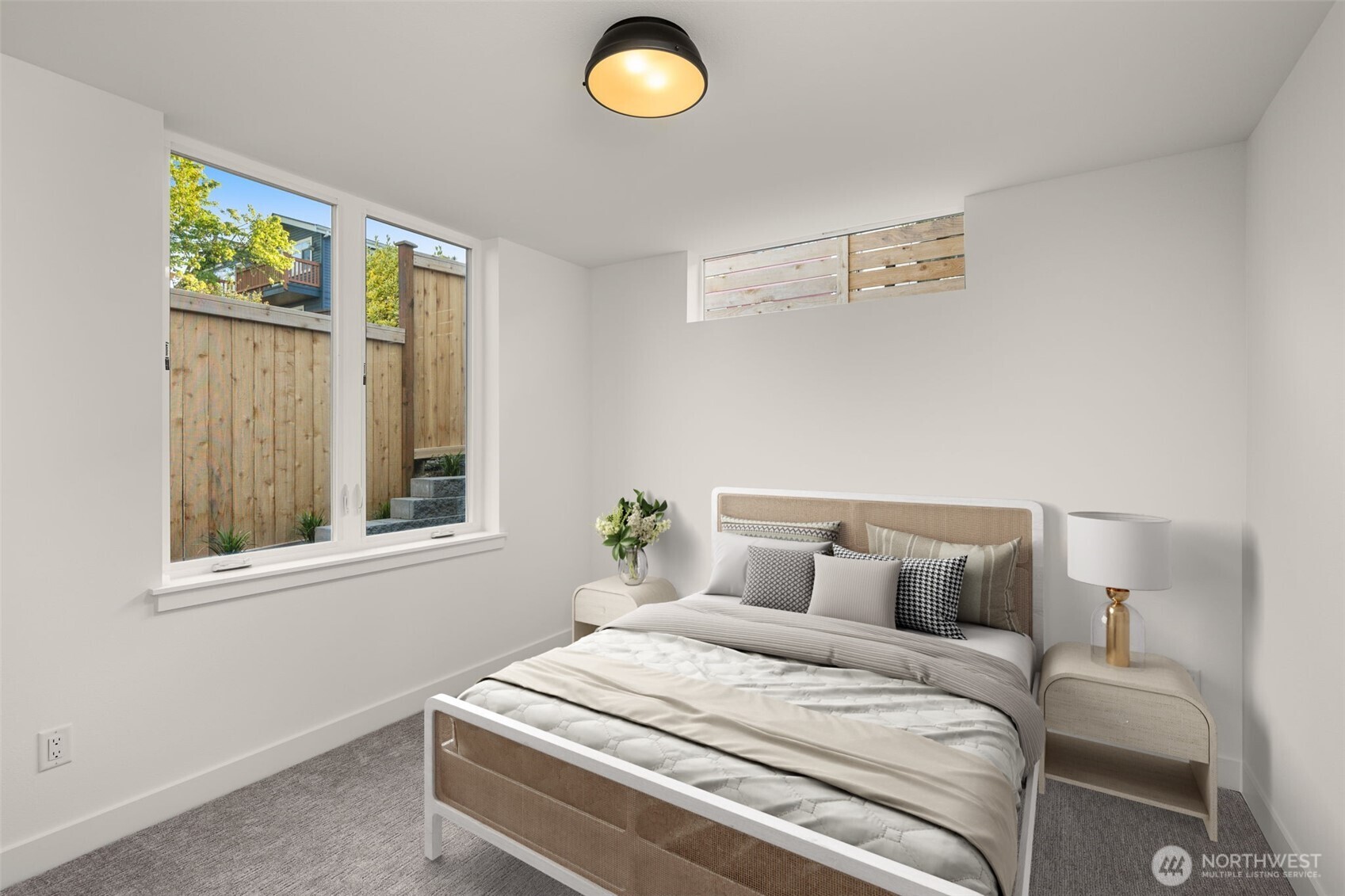 This photo is virtually staged. A secondary bedroom features plush carpet and ductless heating/cooling—perfect for peaceful mornings.