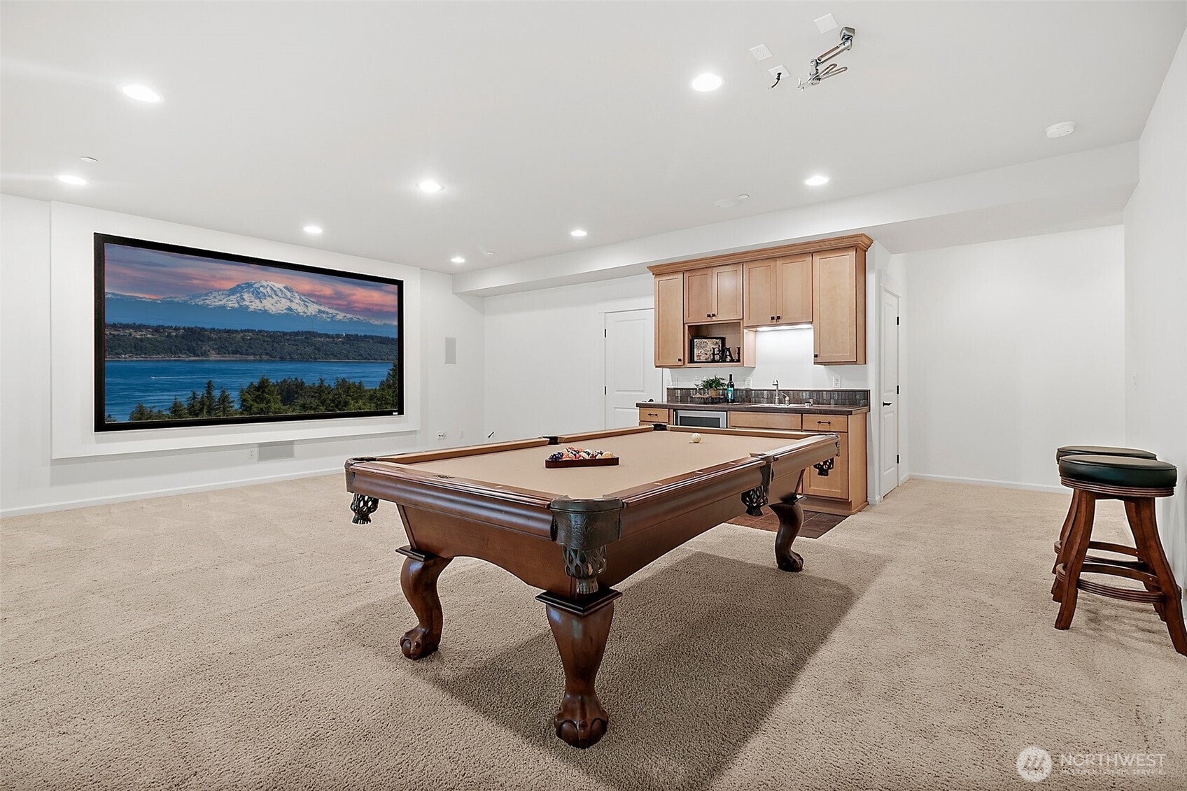 Perfect for entertaining, this stylish wet bar includes a built-in refrigerator to keep drinks chilled and ready for guests.