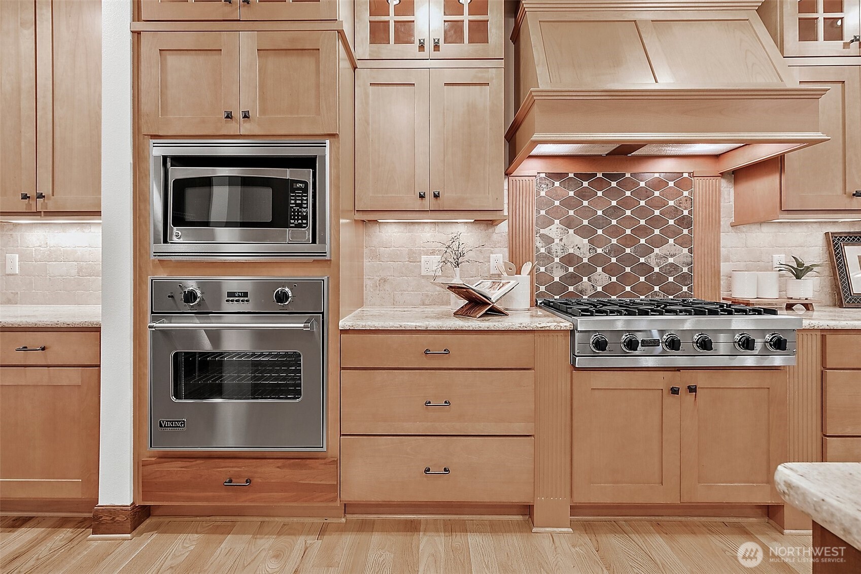 Solid wood cabinetry offers generous storage throughout—keeping everything organized and within reach.