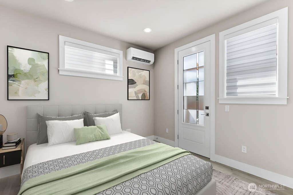 Virtual staging. Lower level bedroom/office has it's own private entry door which opens to patio, mini split for heating/cooling, al large walk-in closet and its own private 3/4 bathroom!