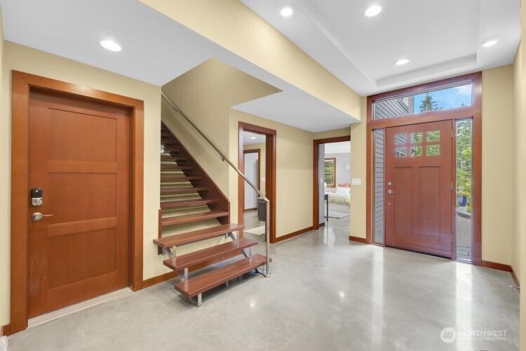 Entry to garage, stairs, 2nd primary and bath