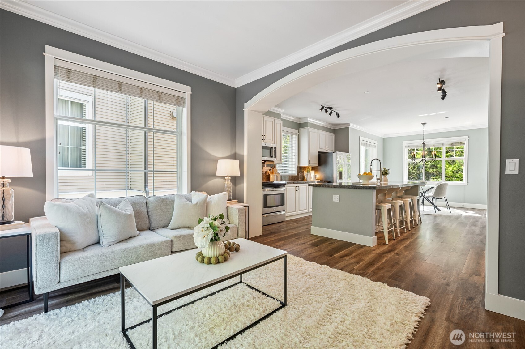 Seamless open flow from living to kitchen and dining.