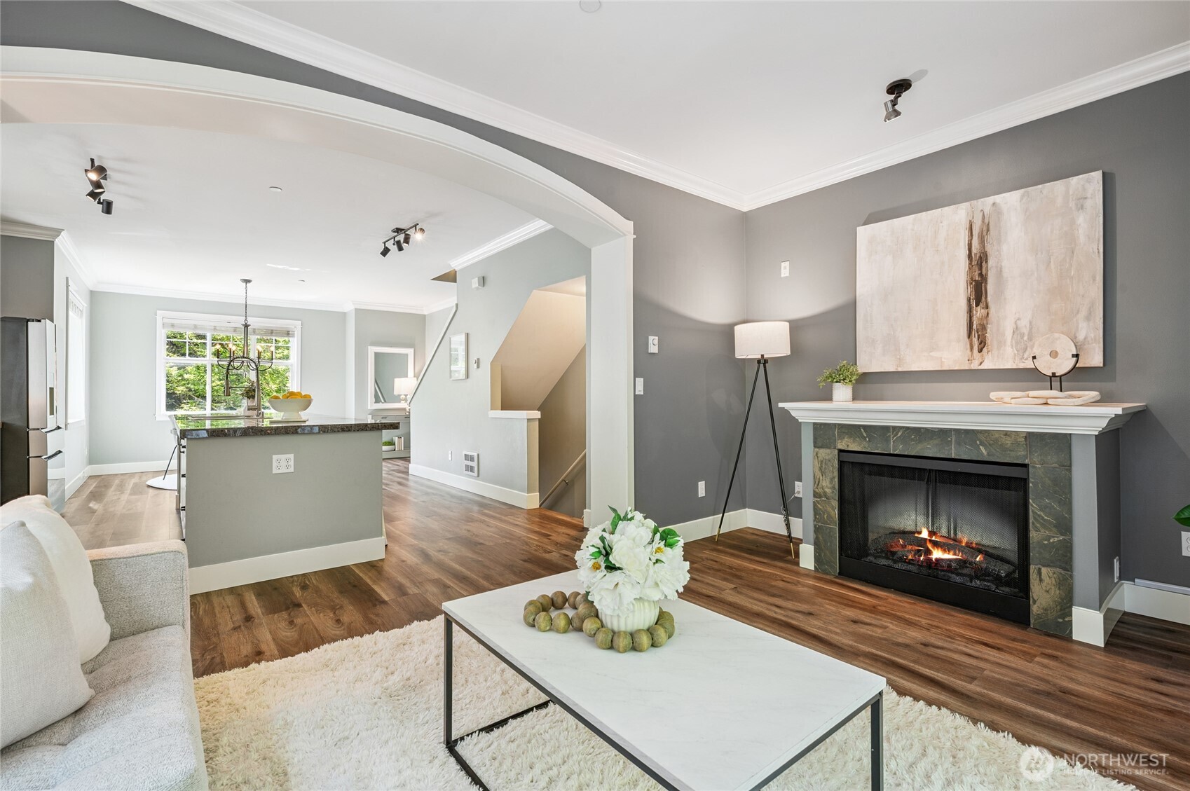 Cozy gas fireplace anchors the inviting living space.