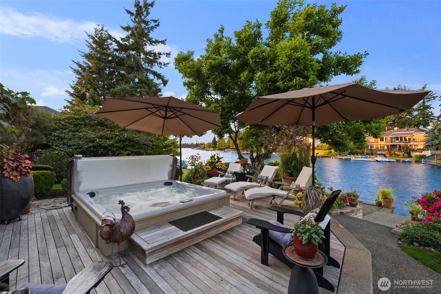 Built in spa surrounded by custom Brazilian walnut decking overlooking breathtaking lake & mountain views.