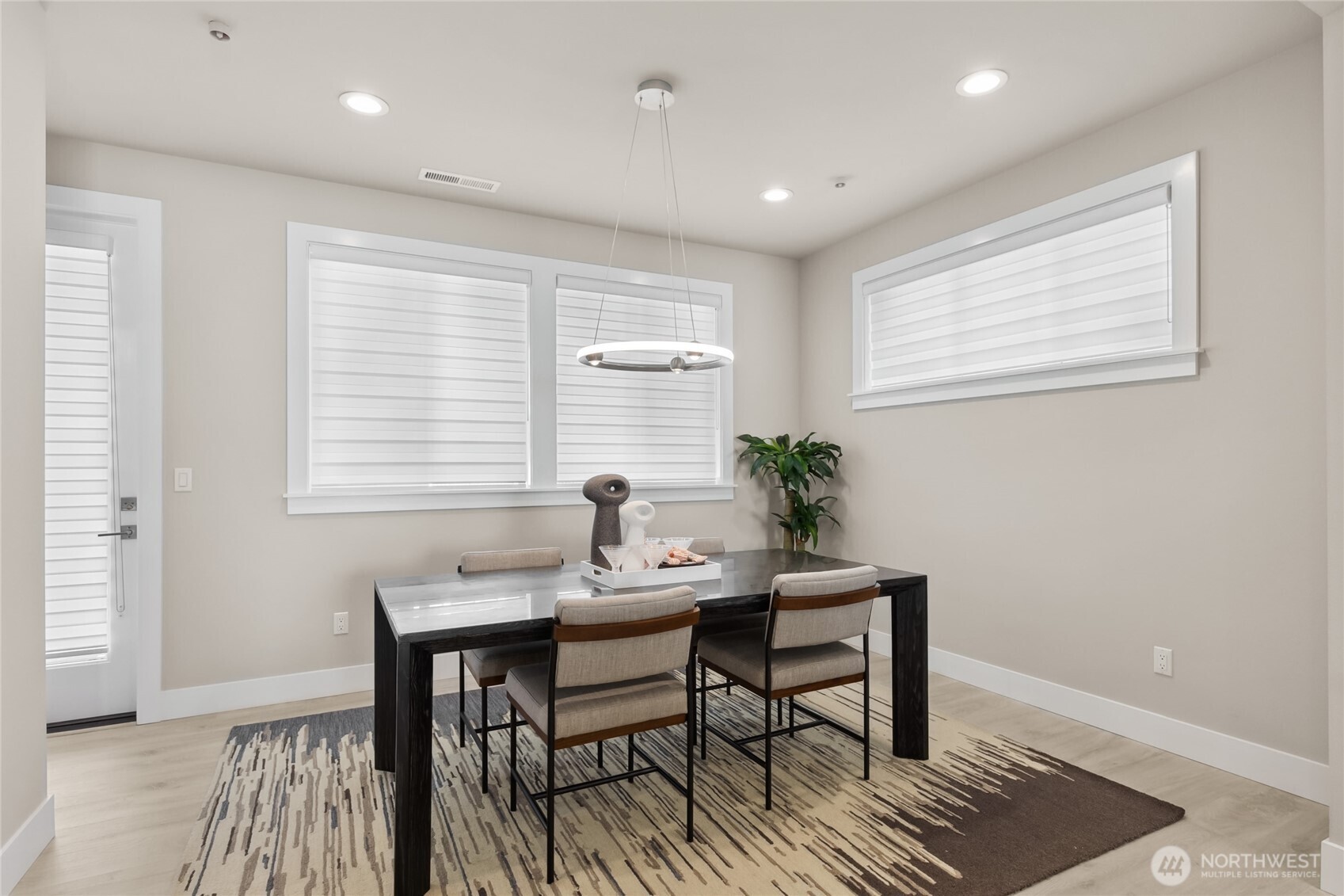 Beyond the large dining room windows lies the full width covered Trex deck. This is super convenient for outdoor dining and entertainment.