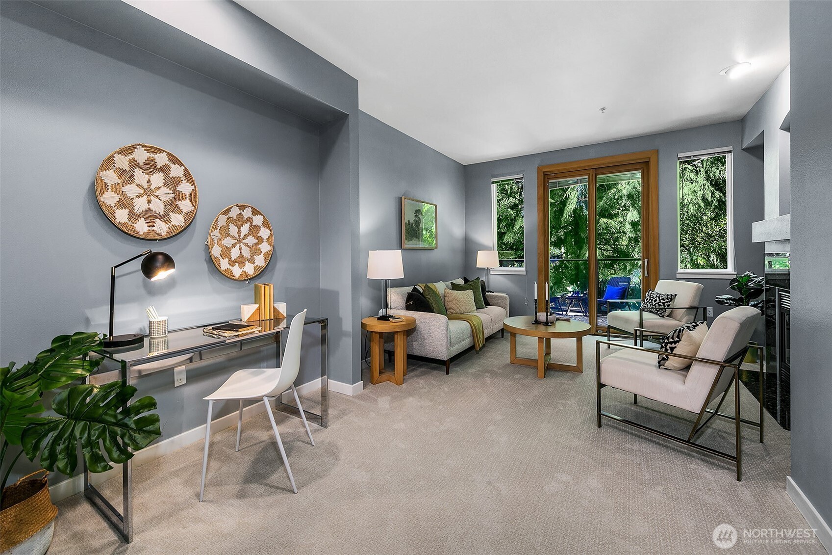 Lovely living room with outlooks of trees; very peaceful.