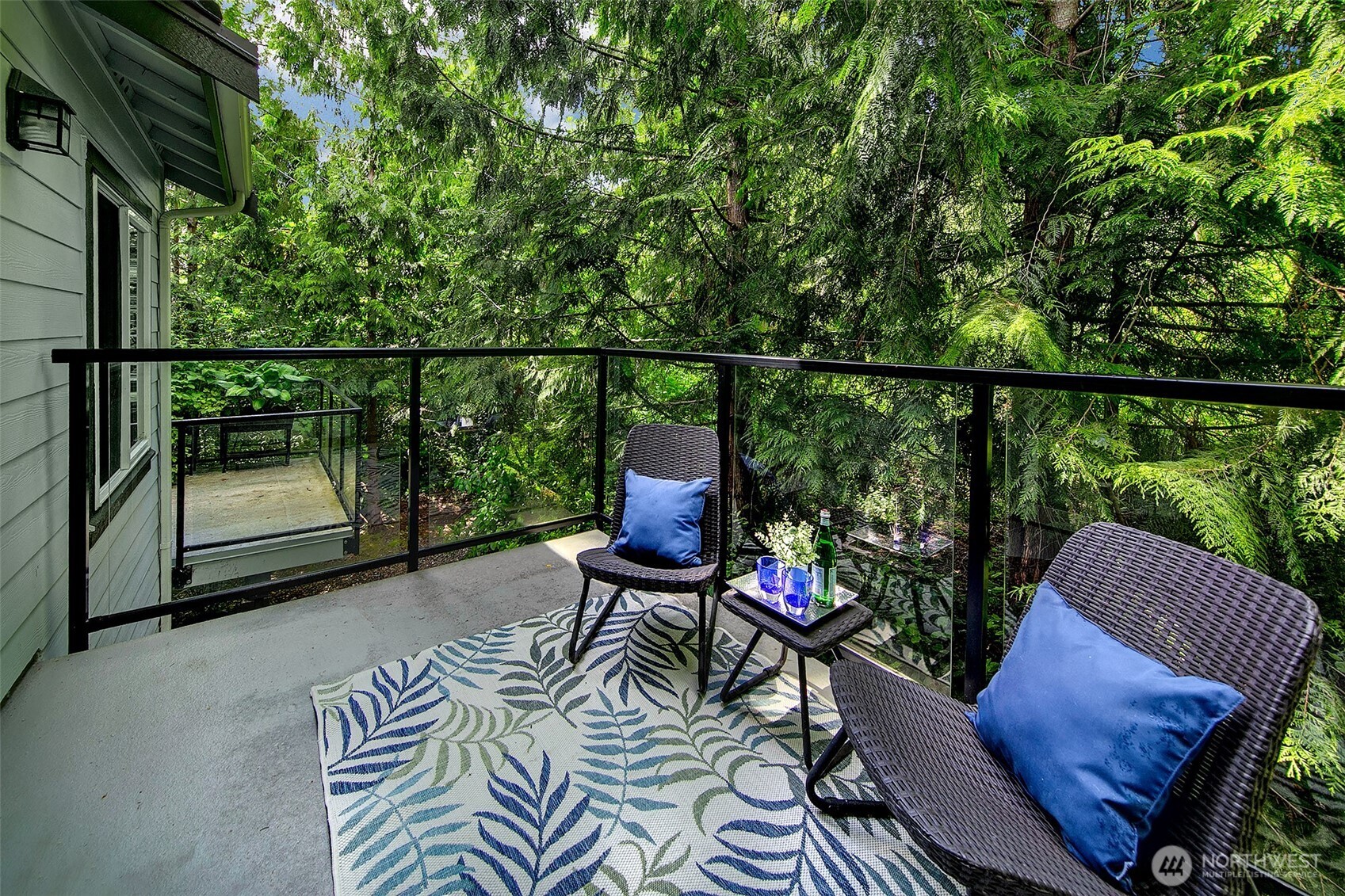 Spacious deck off living room from sliding doors; a great expansion of living space in the summer months.
