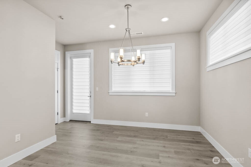 Dining room opens to the patio with the huge covered Trex deck that spans the full width of home.