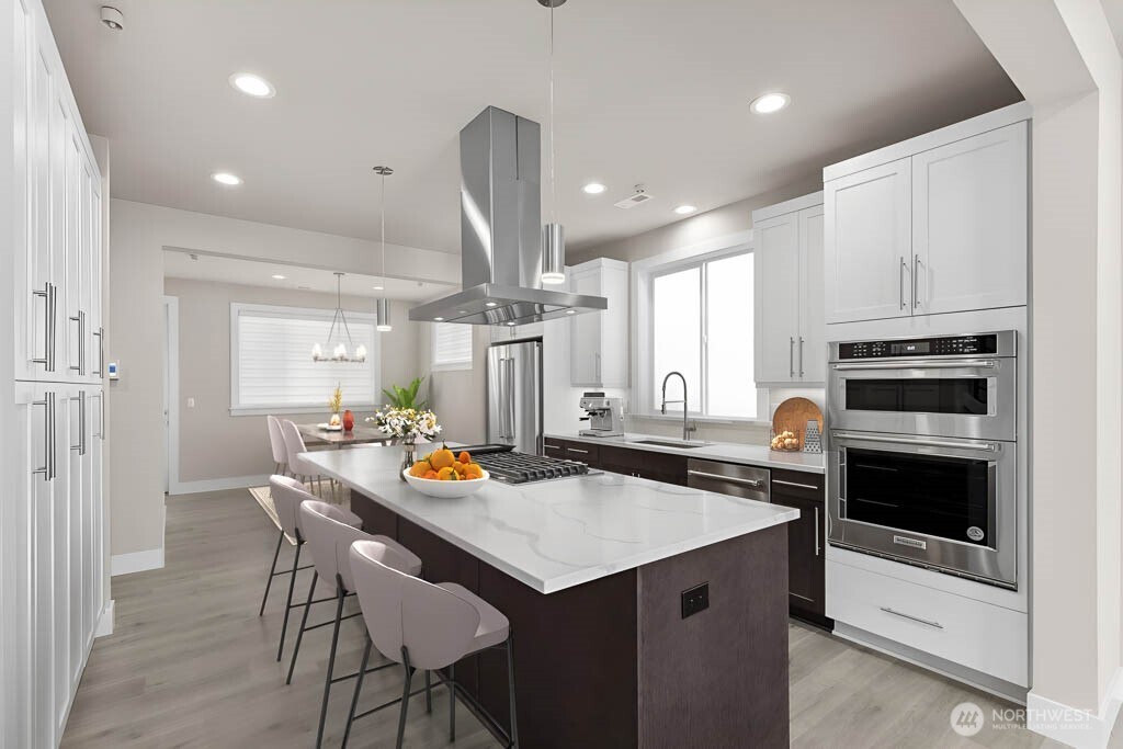 Virtual staging. Thick slab quartz countertops, 5 burner gas range, two tone cabinetry w/soft close cabinets, and full height tile backsplash!