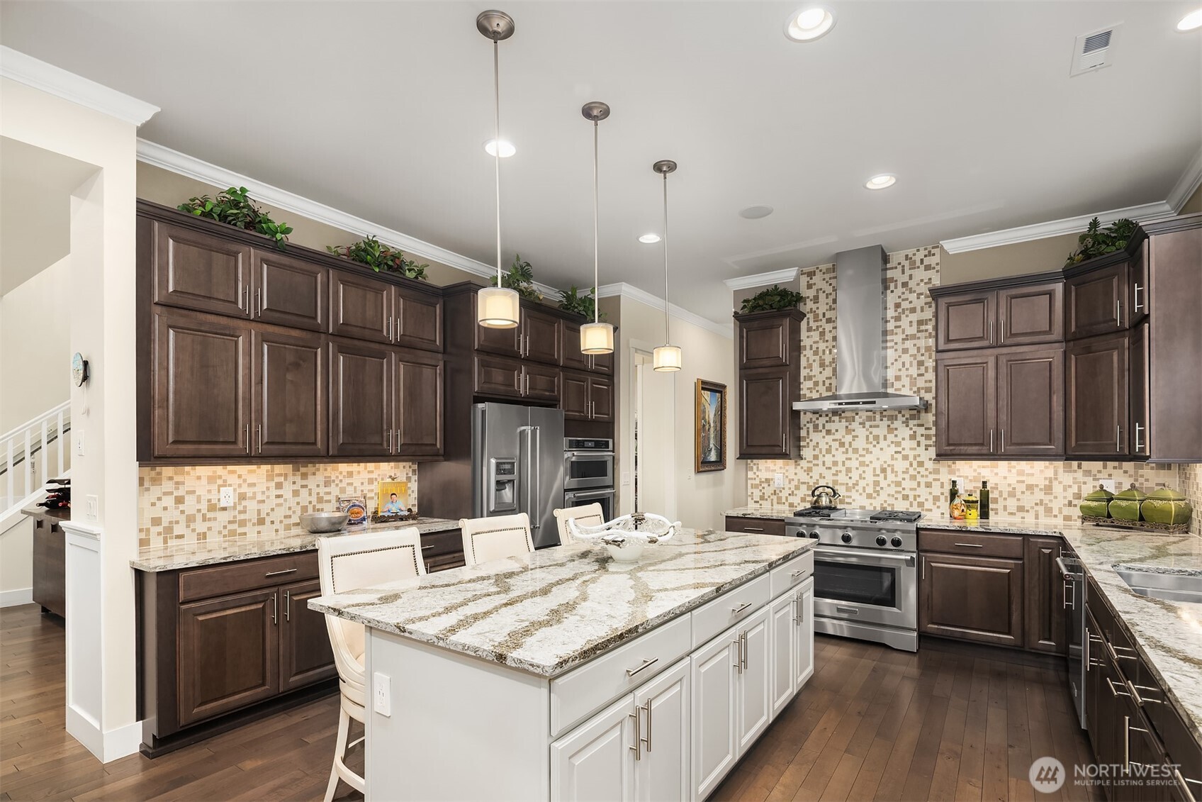The central kitchen island has room for seating, working, cooking, or just hanging out.