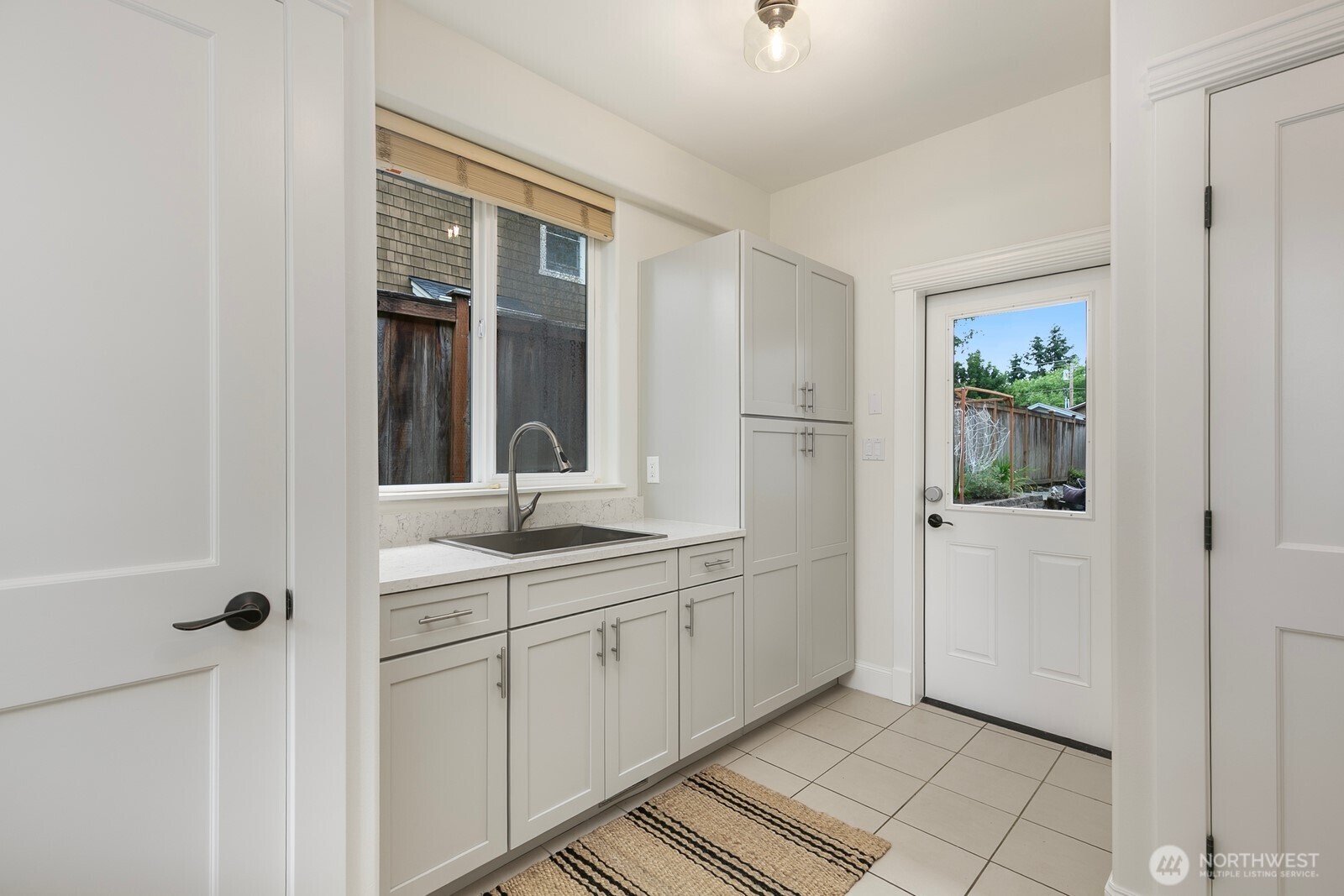 On the other side of the kitchen, the remodeled mudroom sits, as well as utility closets.
