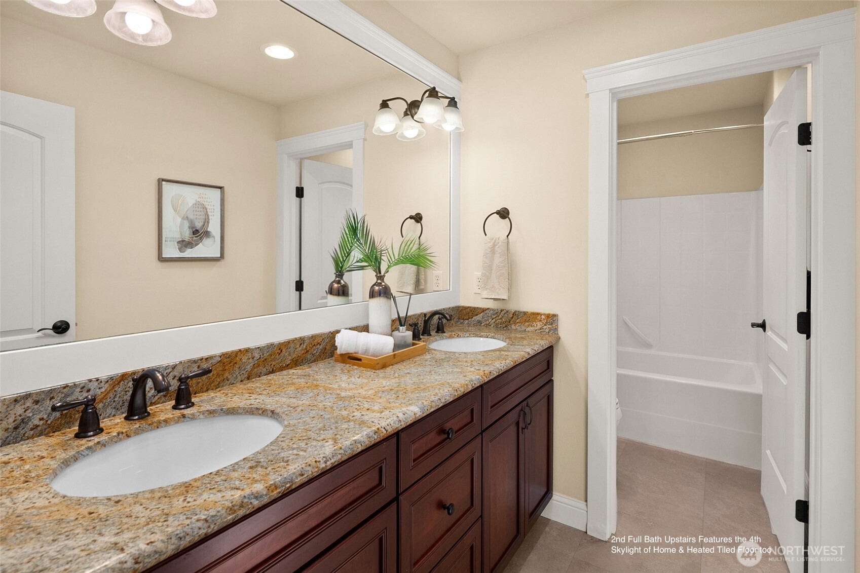 Heated tiled floor & skylight in 2nd full bath upstairs.