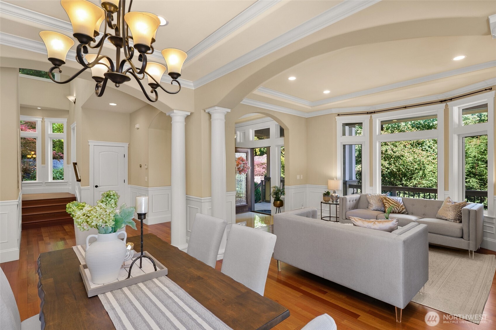 Flawless floor plan with 10' coffered ceilings, grand tiled entry, exquisite columns, crown moldings and wainscoting throughout office, formal living and dining rooms. Beautiful formal dining room showcases stately columns and arched openings.