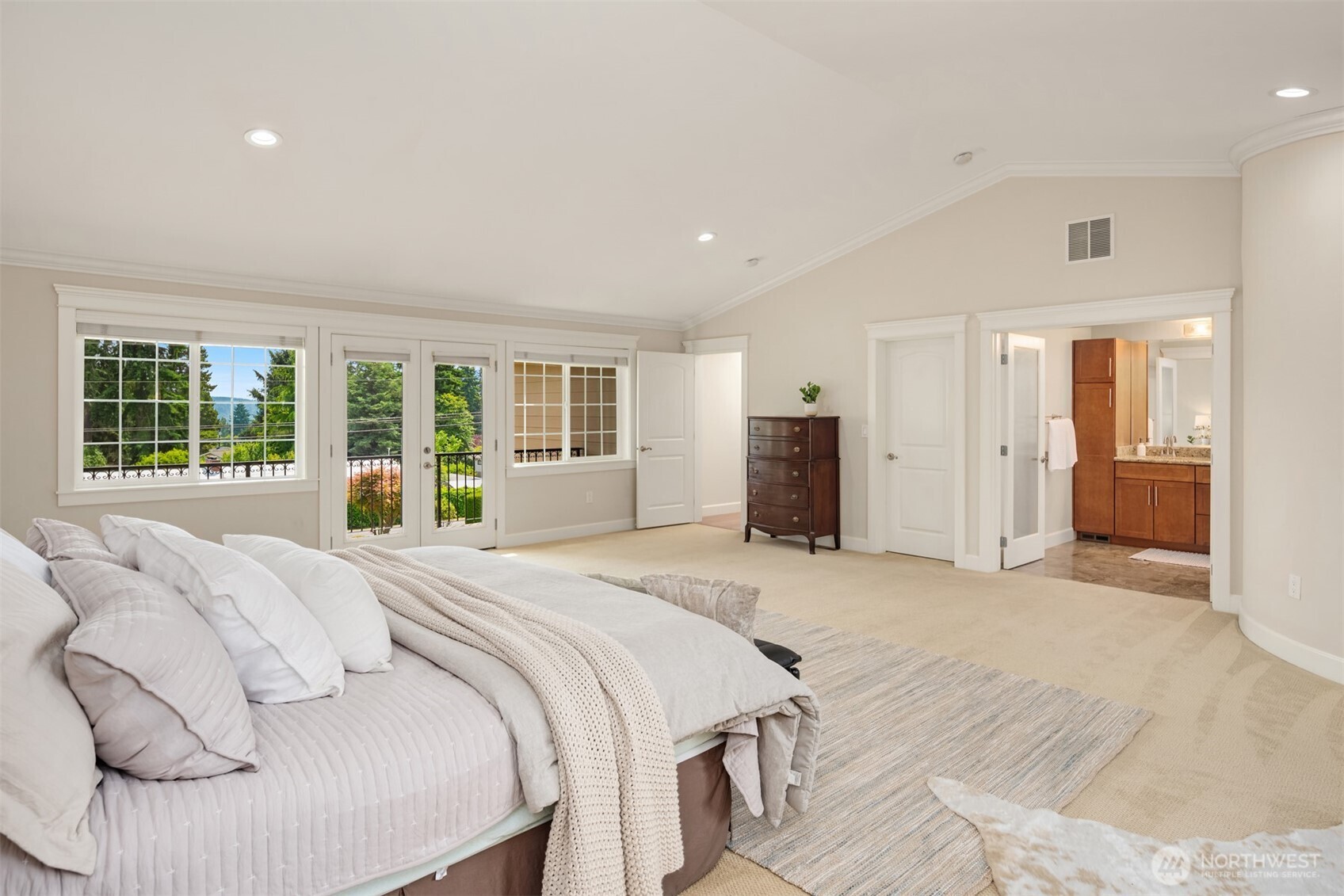 2nd floor primary suite with French doors to balcony