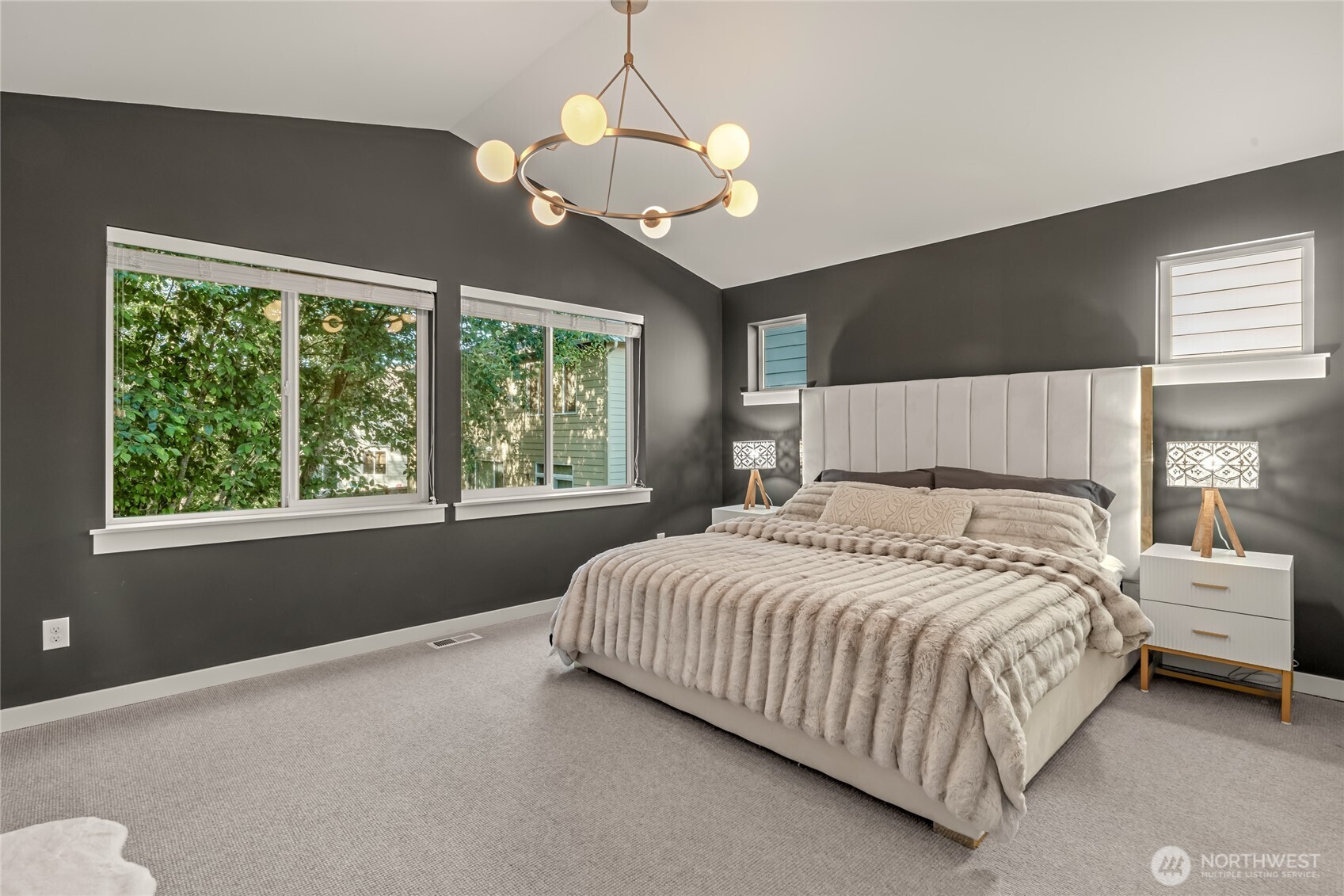Grand Entrance: Double doors open to an oversized primary bedroom.
