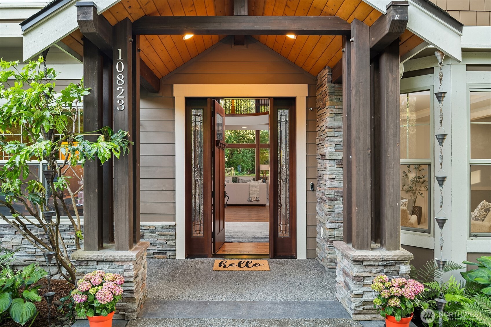 Welcoming post & beam entry porch, and craftsman wood & leaded glass entry door.