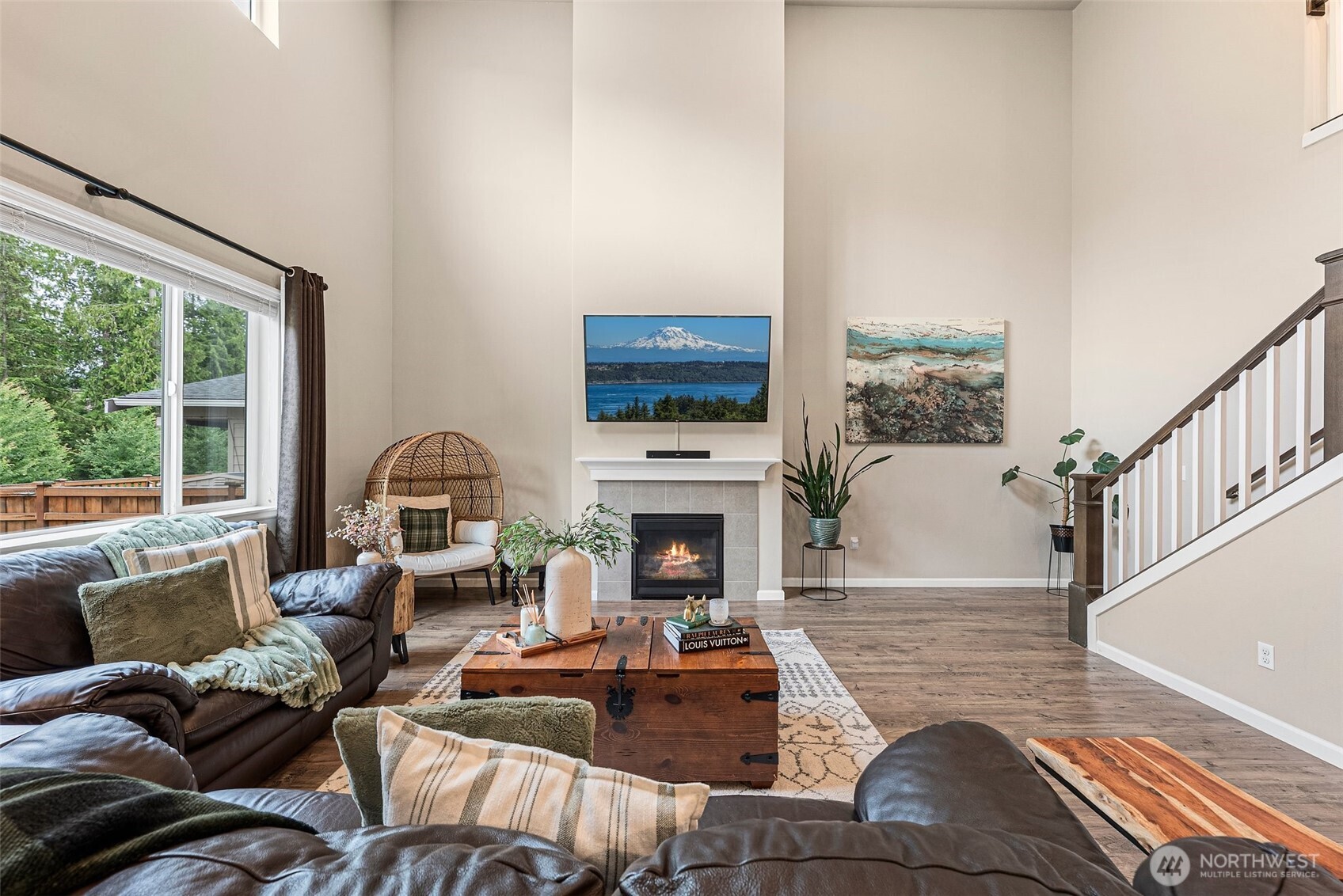 Open concept floor plan w/soaring ceilings & large windows for natural light.