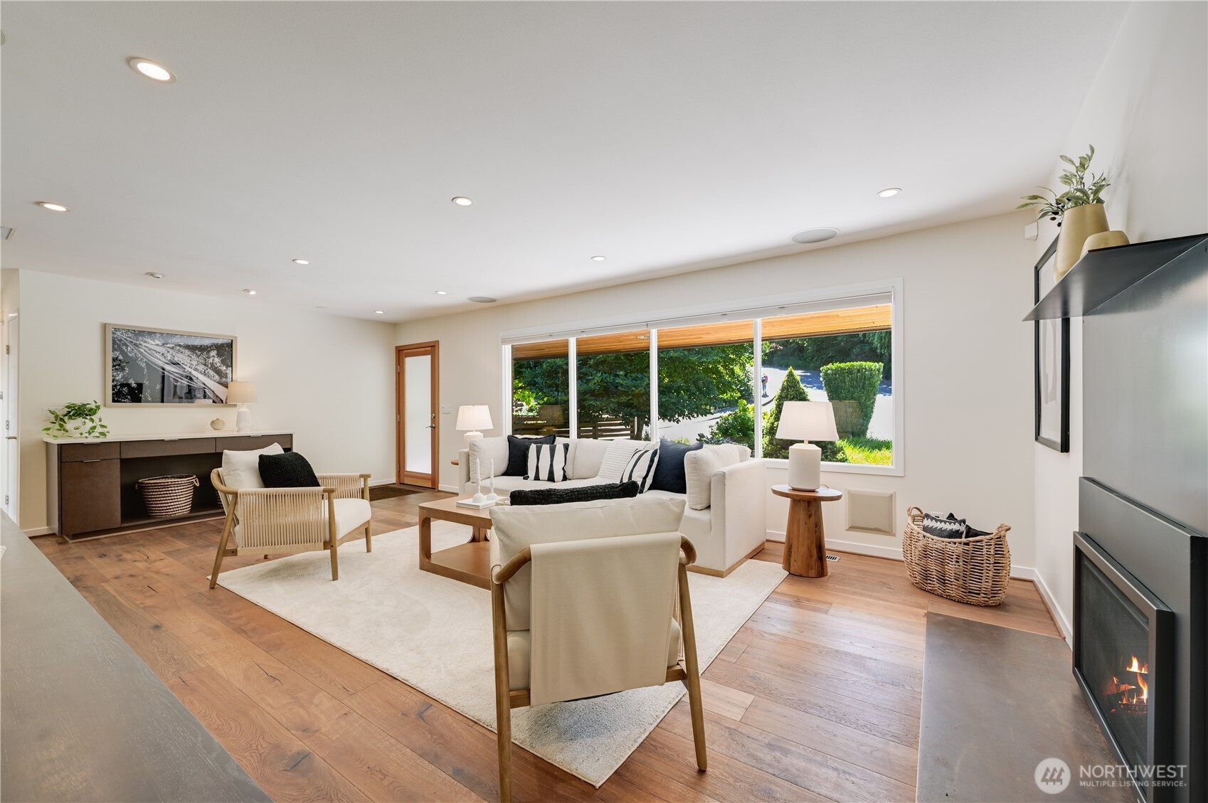 Another view of the gracious living room looking with picturesque grand windows for natural light.