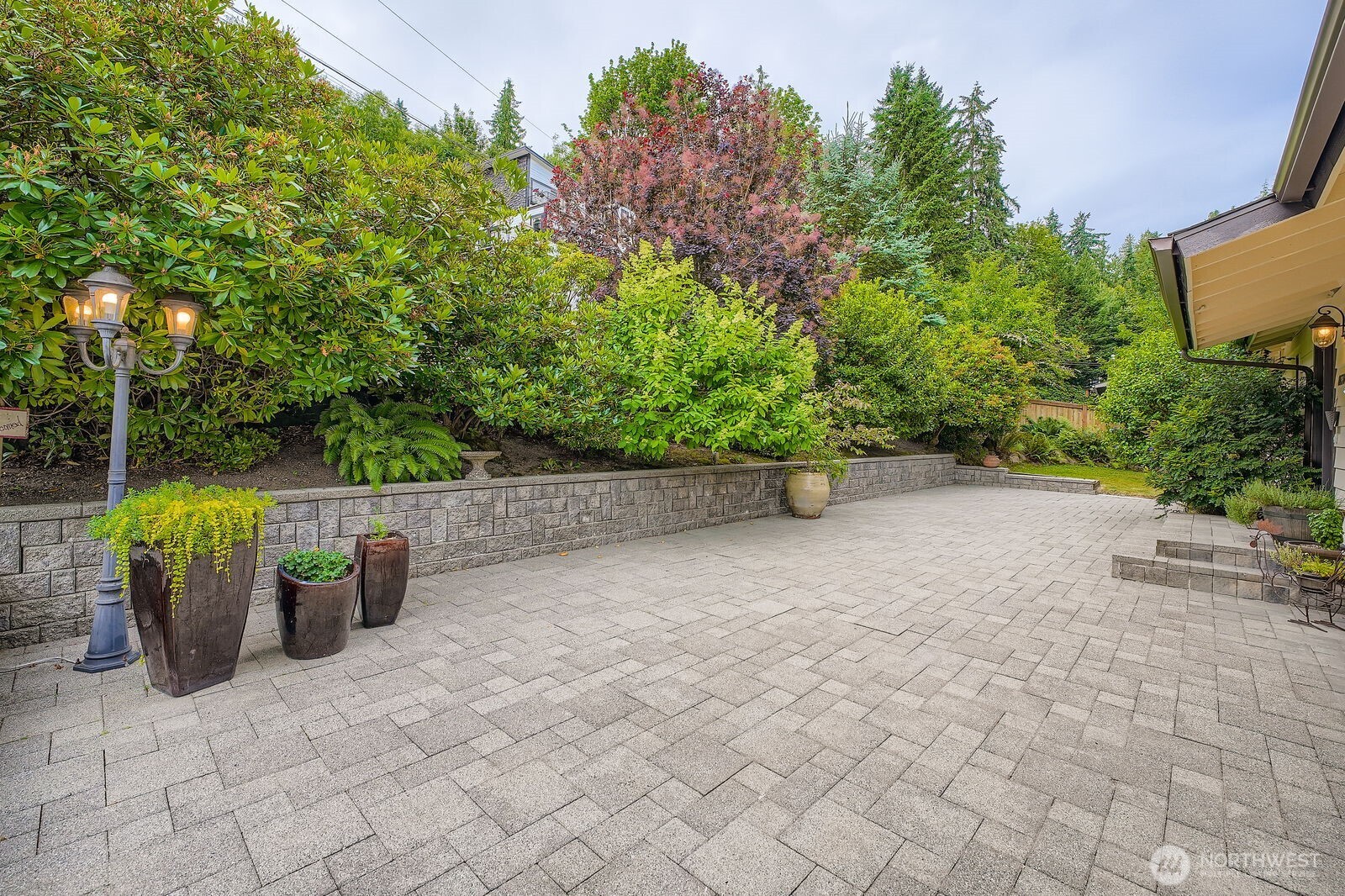 Custom Courtyard, great for outdoor furniture with low yard maintenance. Beautiful mature landscaping.