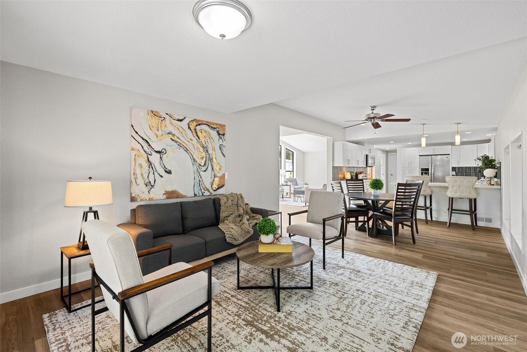 Family room just off the kitchen is a gathering hub and connector.