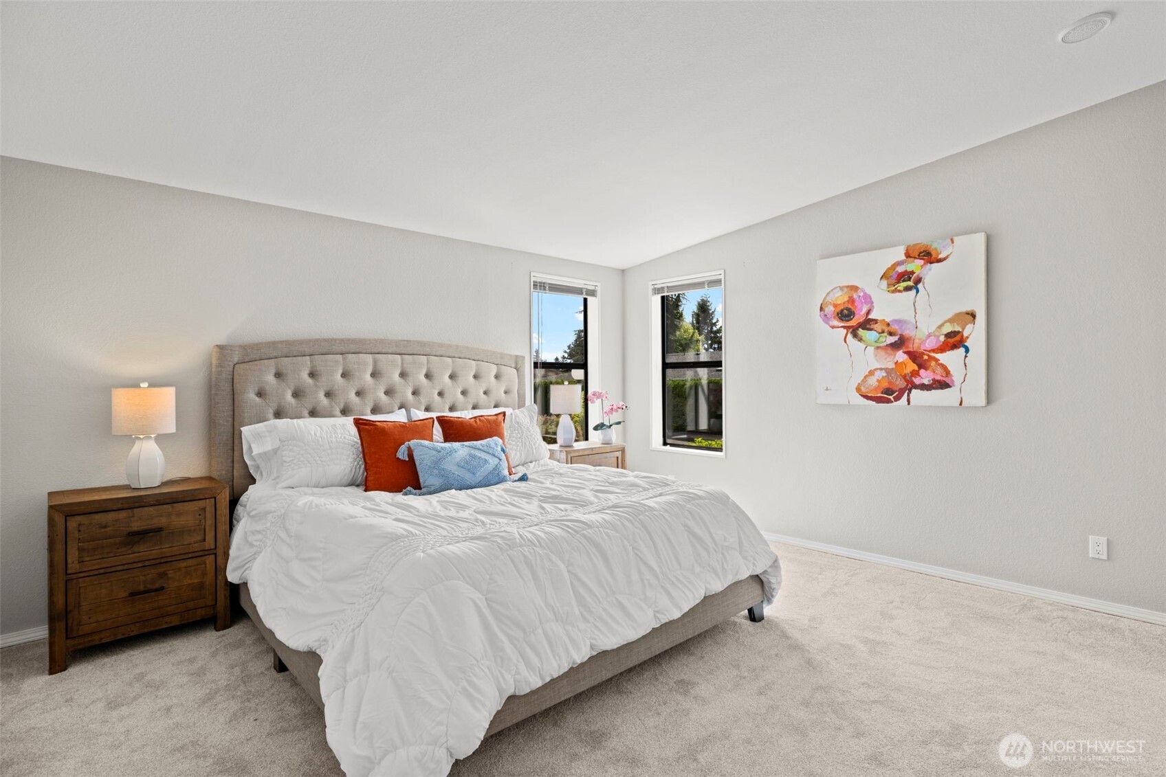 Spacious primary retreat! New carpet. Adjoining 3/4 bath en suite.