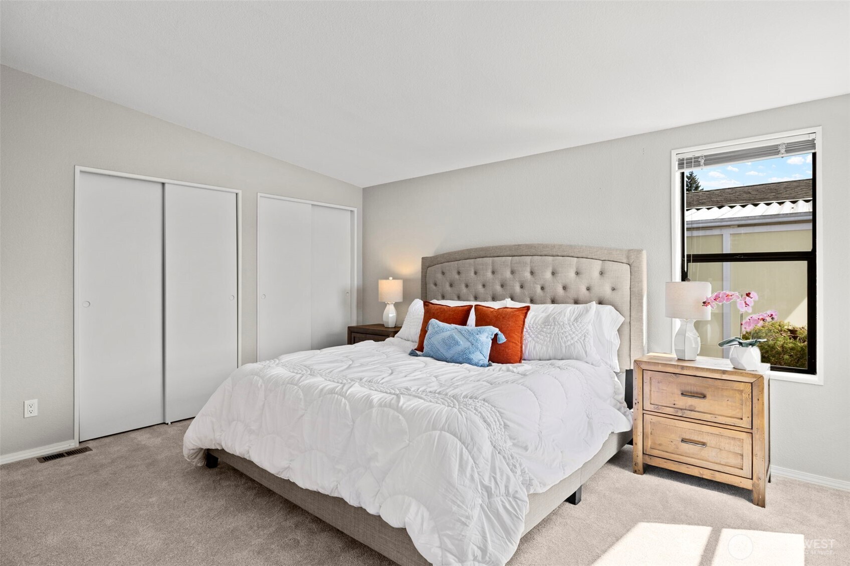 Primary bedroom with dual adjoining closets.