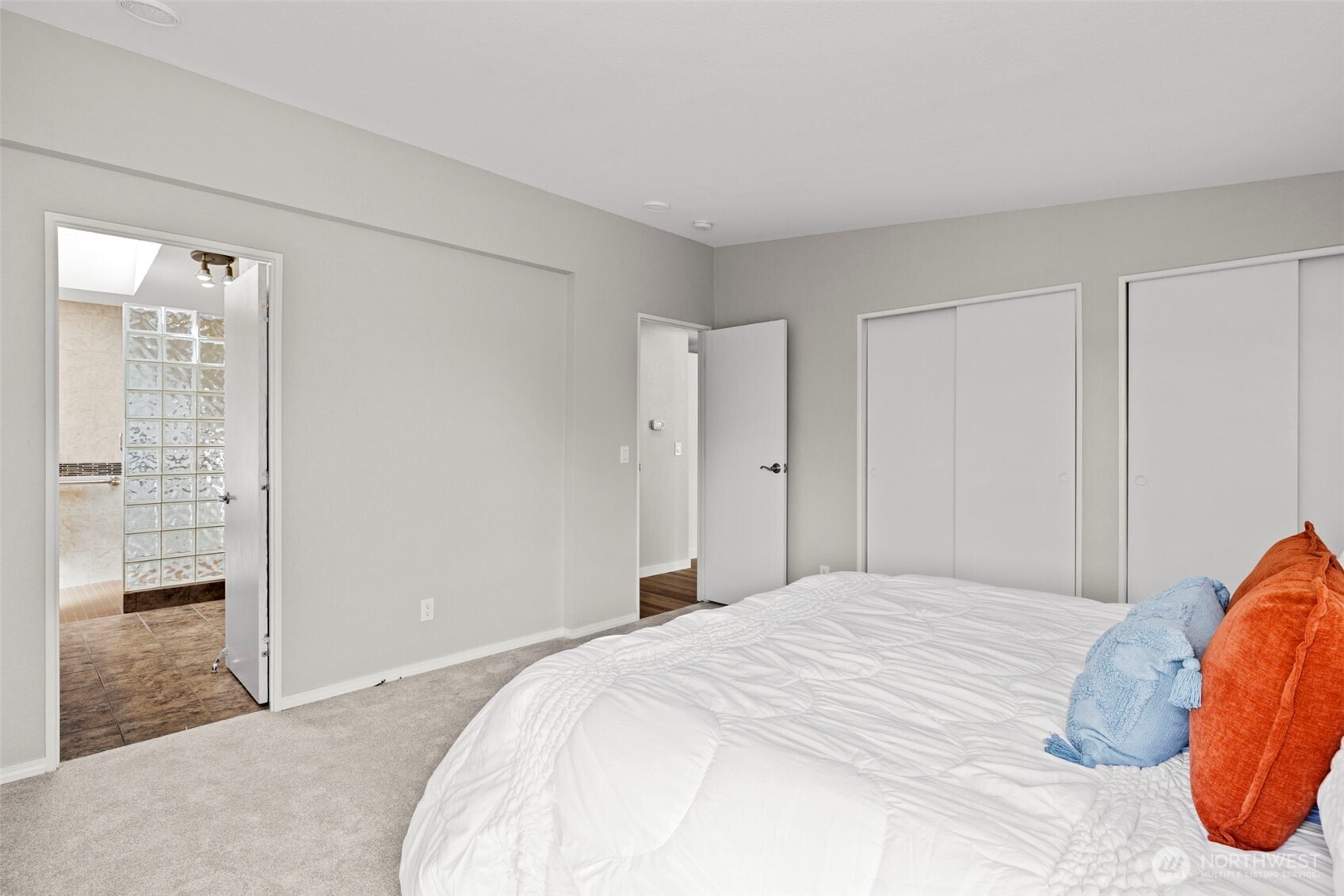 3/4 bath en suite. Tile floors and glass block shower wall.