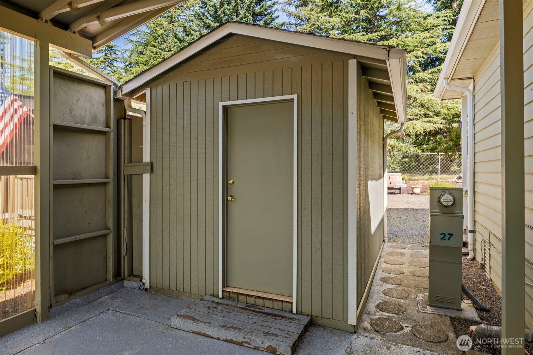 Storage shed off carport stays.