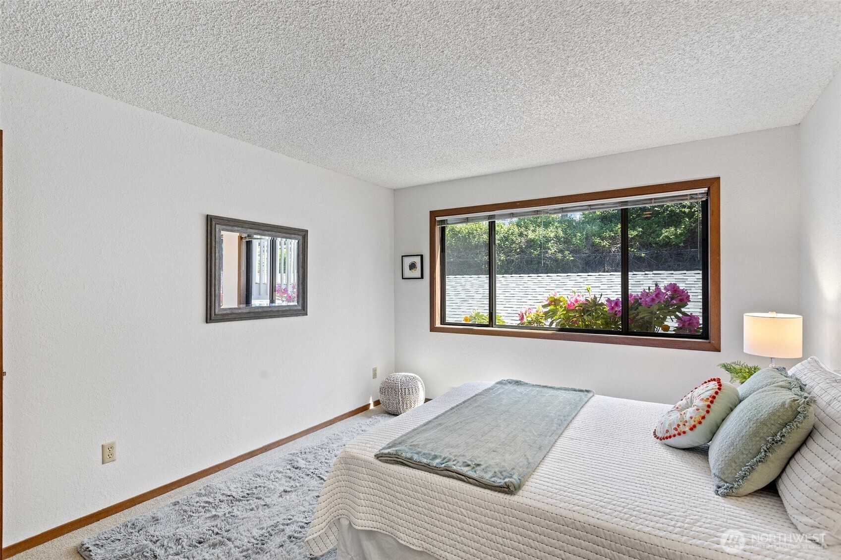 This 2nd bedroom has extra space for seating, a desk, drawers or even sharing with your sibling.